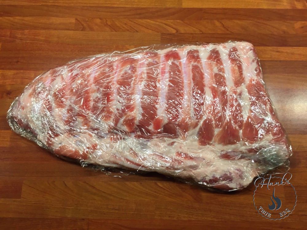 Ribs, dry brine applied, wrapped in saran wrap