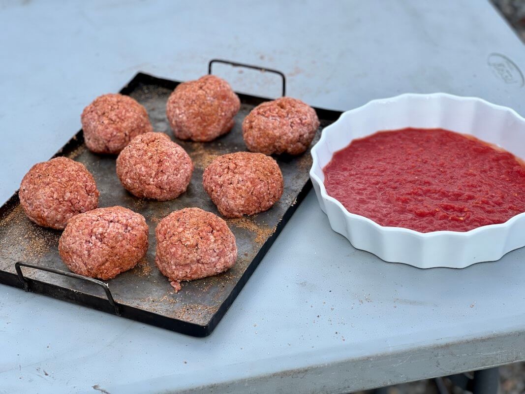 Meatballs and tomato sauce separately