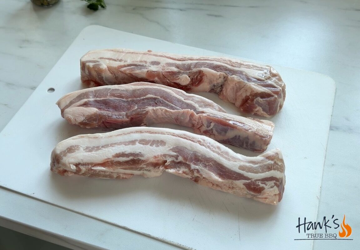 Pork belly fat fingers raw and cut into strips